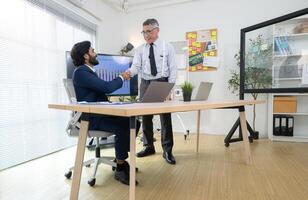In a contemporary office, two senior executives with a mission to brainstorm and monitor,73 photo