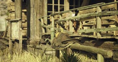 CGI Old western saddle rests on wooden fence at rustic ranch video