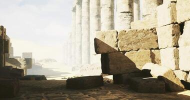 CGI Ancient ruins with towering columns and dust in sunlight at midday video