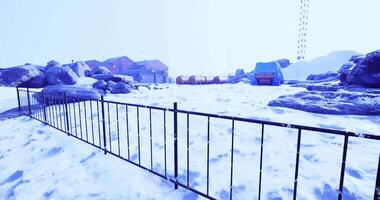 CGI Snowy landscape with rocks and buildings in a remote location during winter video