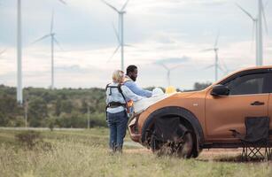 An engineer father and his family do a little more work in front of a car,32 photo