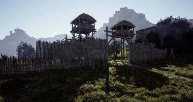 CGI Enchanting medieval fort with watchtowers and lush surroundings at dawn video