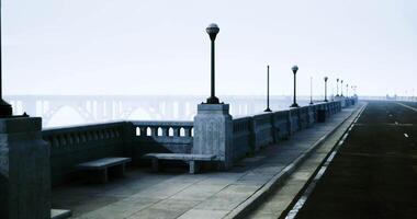 CGI Concrete walkway along a coastal view with lamps in the early morning light video