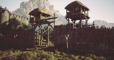 CGI Majestic wooden towers overlook a rustic fortified entrance in nature video