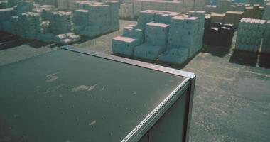 CGI Containers stacked in a busy shipping yard during bright daytime hours video