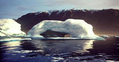 CGI Majestic ice arch formation surrounded by tranquil waters in remote landscape video
