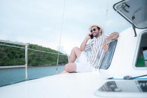 A young man is enjoying his seaside adventure aboard a yacht,89 photo