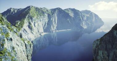 CGI Majestic coastal cliffs overlooking serene blue waters at dawn video