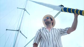 A young man is enjoying his seaside adventure aboard a yacht,56 photo