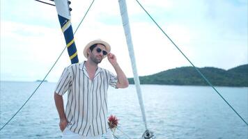 A young man is enjoying his seaside adventure aboard a yacht,51 photo