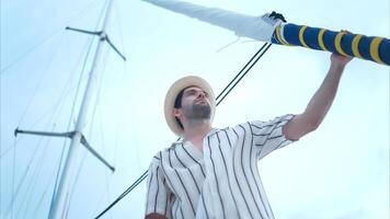 A young man is enjoying his seaside adventure aboard a yacht,52 photo