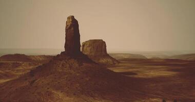CGI Desert landscape featuring a towering rock formation under a hazy sky video