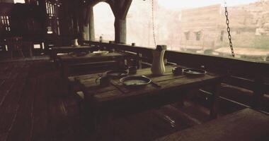 CGI Rustic dining area in an ancient building overlooking a scenic landscape video