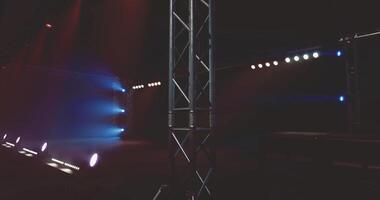CGI Colorful stage lighting illuminates a theater setup for an event video