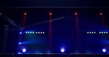 CGI Bright stage lights prepare for an upcoming performance in a dark venue video
