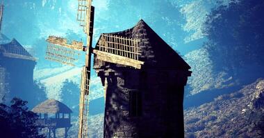 CGI Historic windmill stands tall against a serene landscape during daylight hours video