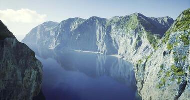 CGI Majestic cliffs reflecting in pristine blue waters of remote cove video