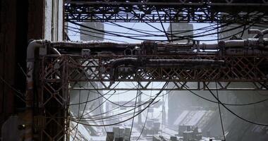 CGI Abandoned industrial site with rusted structures and tangled wires in daylight video