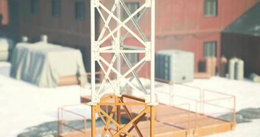 CGI Industrial structure stands tall in a snowy, remote location during winter video