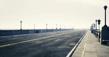 CGI Quiet walkway along a foggy oceanfront under muted sky video
