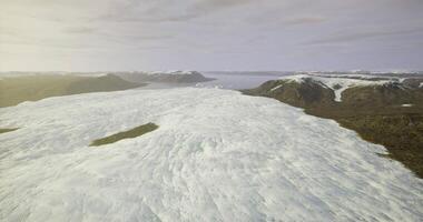 CGI Vast ice expanse stretches across dramatic mountain landscape in remote area video