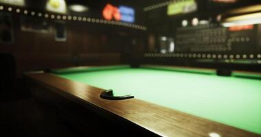 CGI Pool table in a dimly lit bar with vibrant neon signs above video