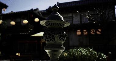 CGI Lantern lit garden at dusk showcases traditional architecture and design video