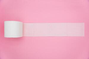 White toilet paper unrolling. Hygiene products. From top view photo