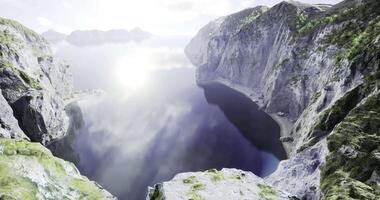 CGI Stunning view of a calm lake surrounded by rocky cliffs in nature video