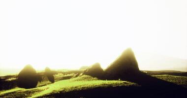 CGI Scenic view of green hills and rocky formations under a bright sun video