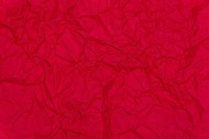 Red crumpled paper background. Crumpled red paper texture photo