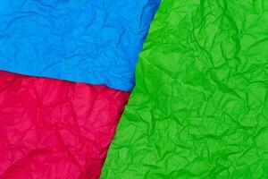 Multicolored crumpled paper texture background. Wrinkled paper surface for designs photo