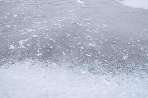 Textured cold frosty surface of ice photo