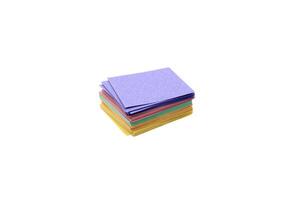 Stack of multicolor sticky note pads isolated on white photo
