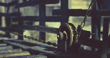 CGI Detailed view of a vintage pulley system attached to wooden fencing video