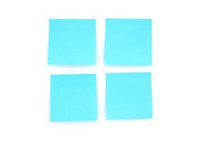 Four blank sticky notes isolated on white, front view adhesive paper with copy space photo