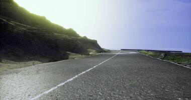 CGI Scenic empty road along the coastline during bright daylight video