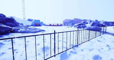 CGI Snow covered landscape with fences and structures in a remote area video