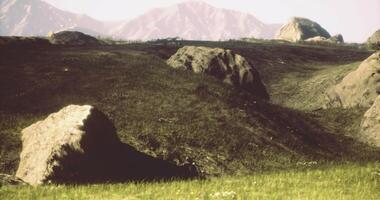 CGI Scenic view of rocky terrain with mountains in the background during daylight video