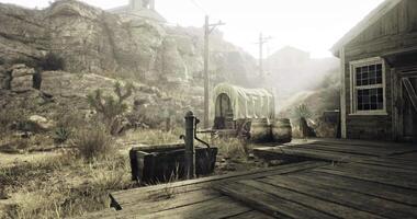 CGI Dusty settlement with wooden structures and a covered wagon at twilight video
