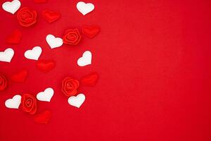 Red and white hearts and roses on a red background. Love concept, copy space, flat lay, place for text, banner, top view photo