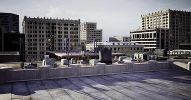 CGI Urban rooftop view showcasing city buildings and structures at sunset video
