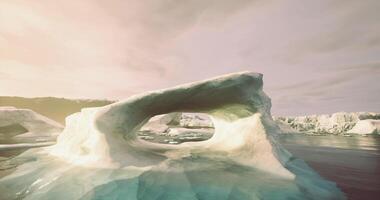 CGI Stunning ice arch formed in a frozen landscape with tranquil water reflections video