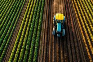Aerial view of tractor plowing field photo