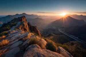 The sun rises over the mountains in arizona photo