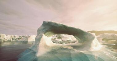 CGI Iceberg with natural arch in serene arctic waters during sunset video