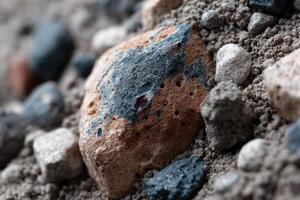 A rock with a blue and white spot on it photo