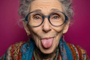 An old woman with glasses sticking out her tongue photo