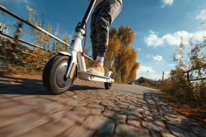 A person riding an electric scooter down a road photo