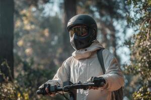 A man in a gas mask and helmet riding a bike photo